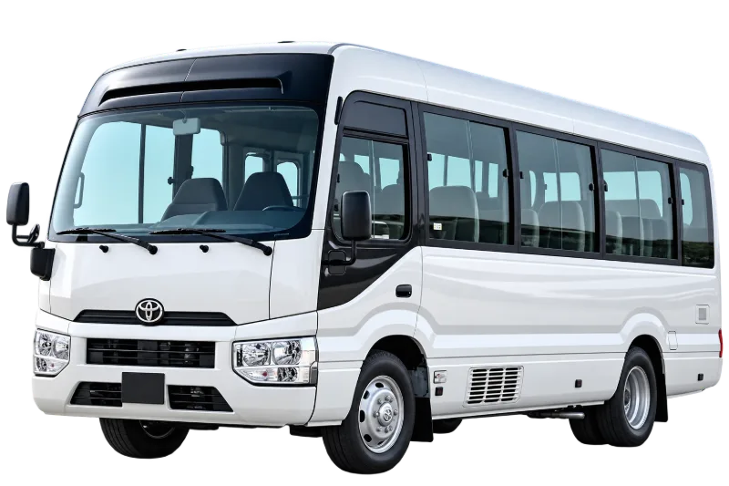White Toyota Coaster minibus for large Umrah groups and Ziyarat tours
